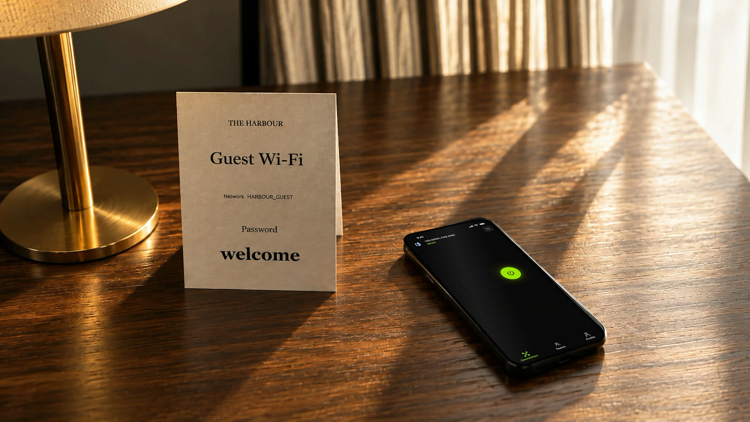 The same hotel nightstand in the morning, low sun across the wood, the phone still connected.
